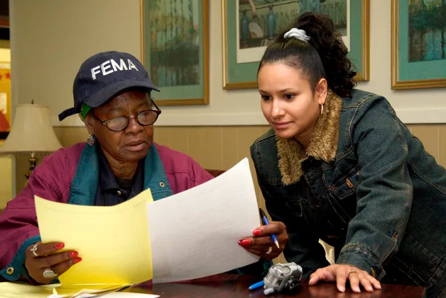 Houston, TX, November 18, 2005 - Bernice Robles, a Spanish linguist CR worker, assists Jacqueline Garcia with FEMA housing paperwork. CR workers are reaching out to evacuees in Houston in several languages. Photo by Ed Edahl/FEMA. How Miami mobile notaries serve Spanish-speaking clients