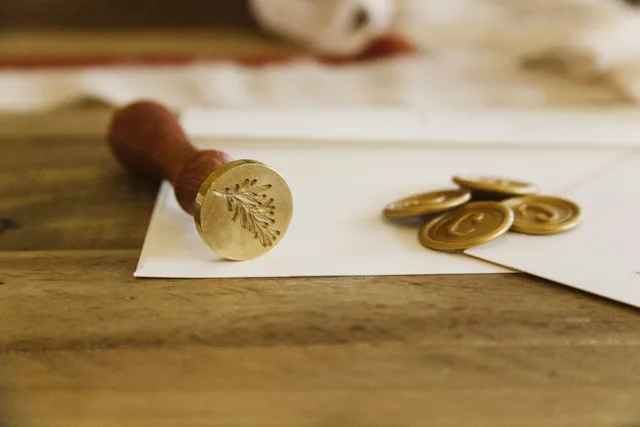 Close-up of a wax seal on an envelope with coins, creating a vintage still life. Which Mobile Notary Tax Deductions Are Legit? A Checklist
