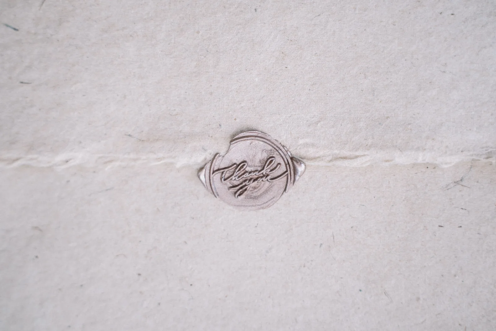 A close-up image of a vintage wax seal on a beige envelope, evoking nostalgia. Mobile notary demand: five local signals business owners can read
