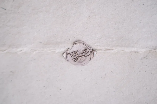 A close-up image of a vintage wax seal on a beige envelope, evoking nostalgia. Mobile notary demand: five local signals business owners can read